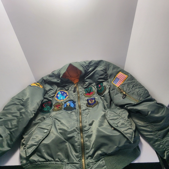 MA-1 style green nylon flight jacket with various Bomber Jacket with Patches
